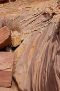 Layered and eroded sandstone in the floor of the canyon