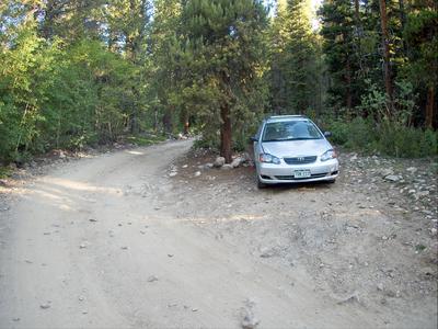 Car parked below the hill where the road turns to 4WD